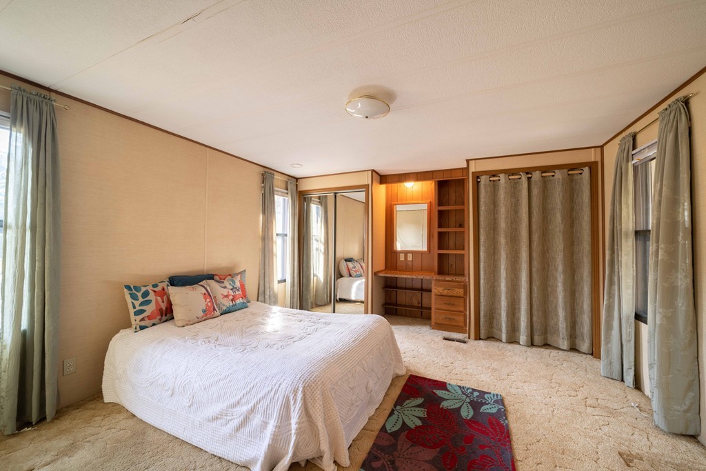 26 Gould Road Ware, MA 01082 - Photo 16 of 23 a bedroom with a large bed and a window