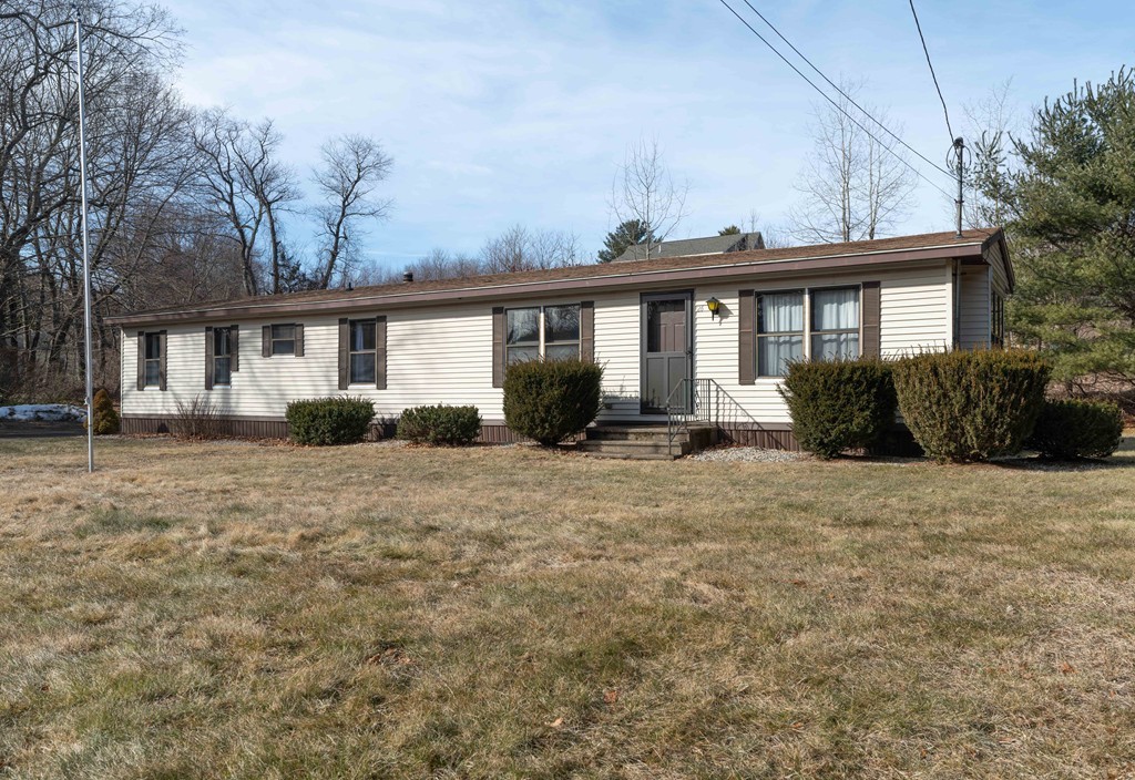 26 Gould Road Ware, MA 01082 - Photo 3 of 23 a front view of house with yard and trees around