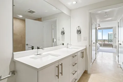 a view of a bathroom with a sink and a mirror