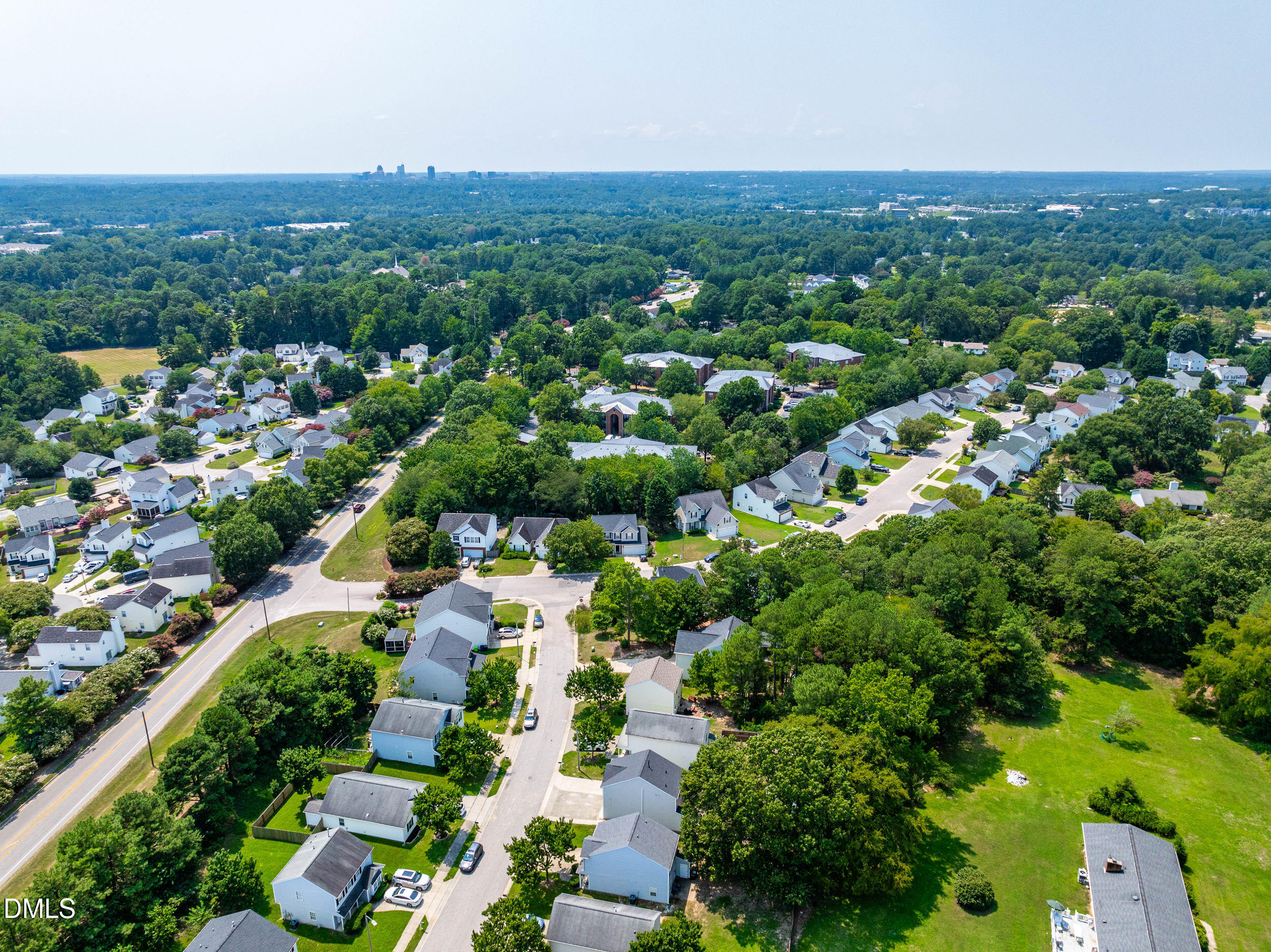 4121 Tensity Drive Raleigh, NC 27604 - Photo 31 of 34 Aerial view with the downtown Raleigh skyline in the distance