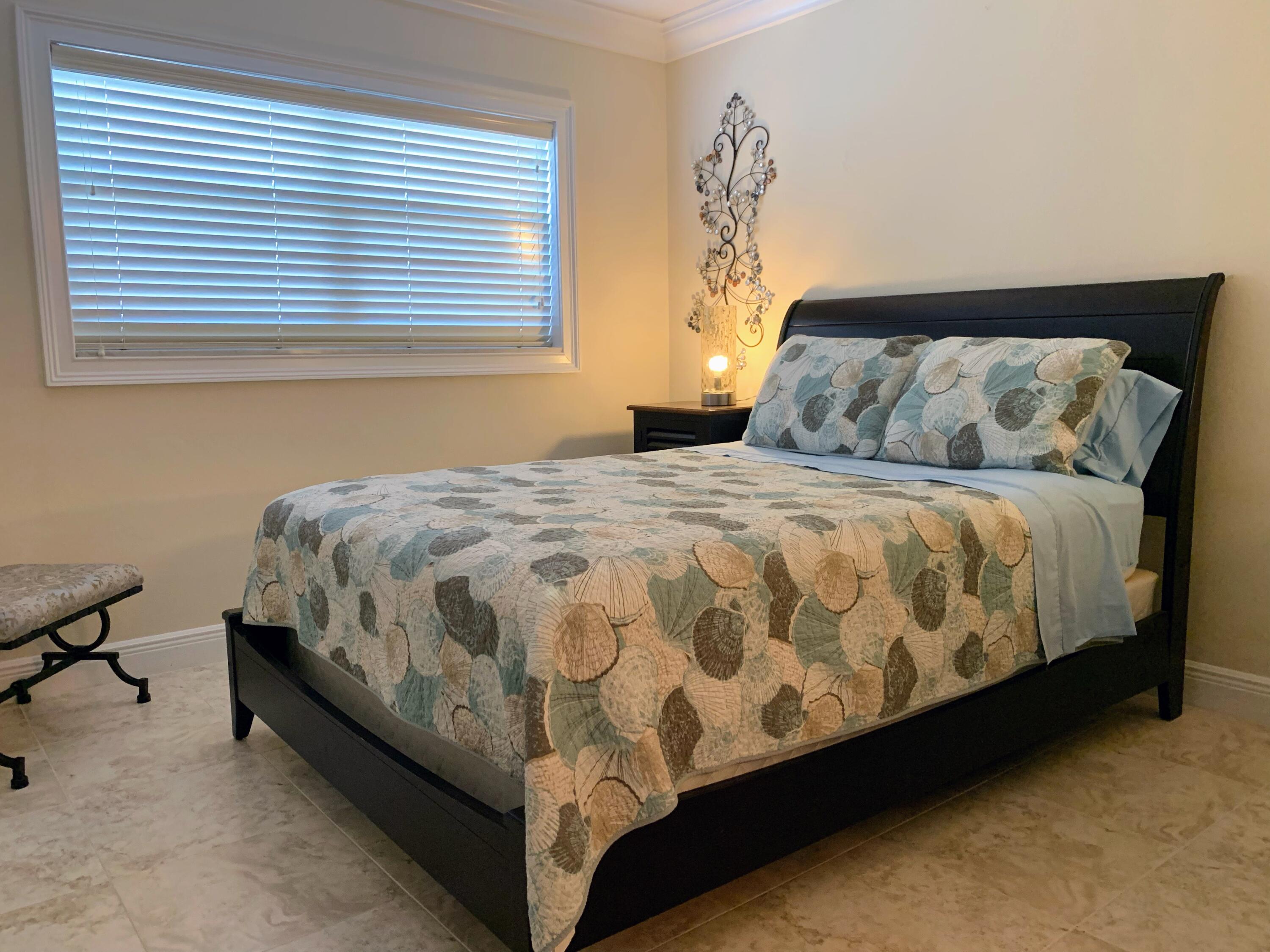 3101 South Ocean Boulevard, Unit 712 Highland Beach, FL 33487 - Photo 14 of 25 a bedroom with a bed and a window