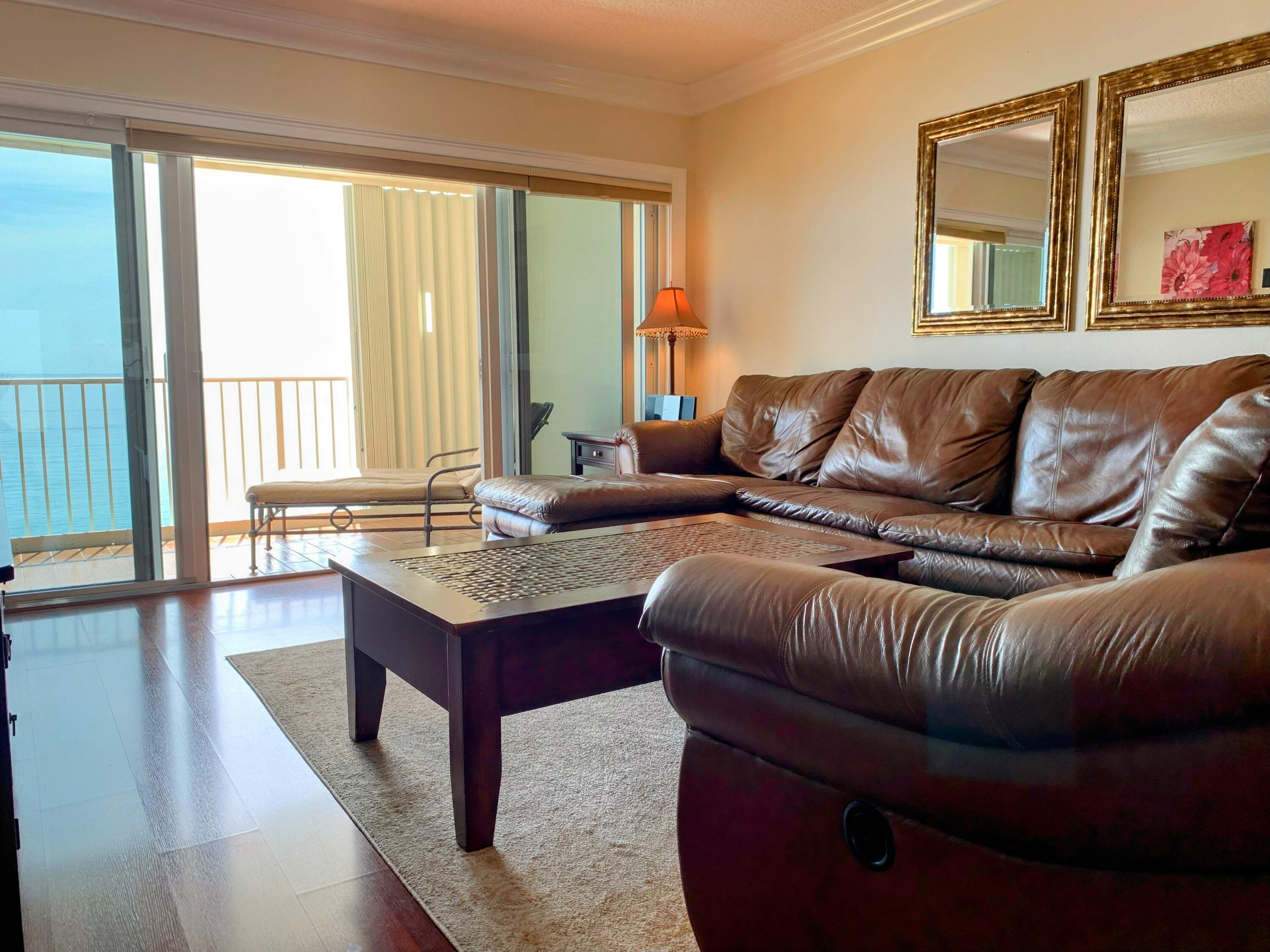 3101 South Ocean Boulevard, Unit 712 Highland Beach, FL 33487 - Photo 9 of 25 a living room with furniture and a large window