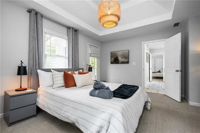 a bedroom with bed and window