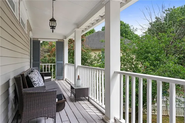 a view of balcony with furniture