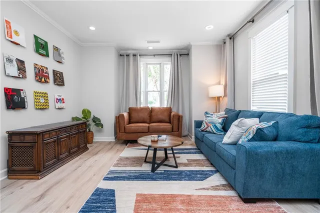 a living room with furniture and a rug