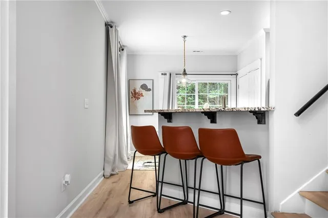 a view of a kitchen with furniture and window