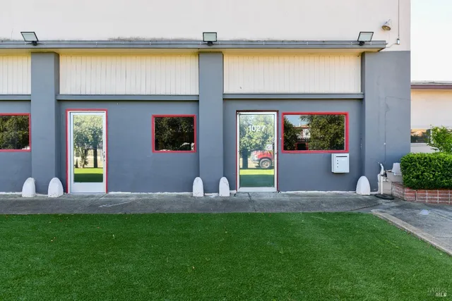 a view of front door of the house with a swimming pool