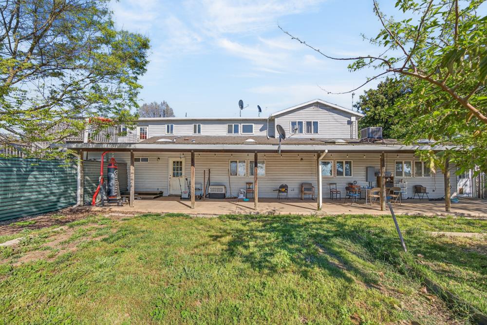 13512 Alta Mesa Road Galt, CA 95632 - Photo 51 of 99 a view of a house with a yard and sitting area