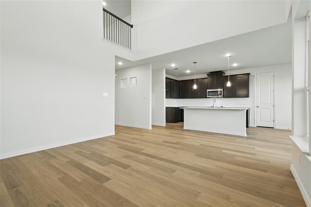 2521 Rivers West Road Anna, TX 75409 - Photo 12 of 40 a view of a kitchen with a sink and a large window
