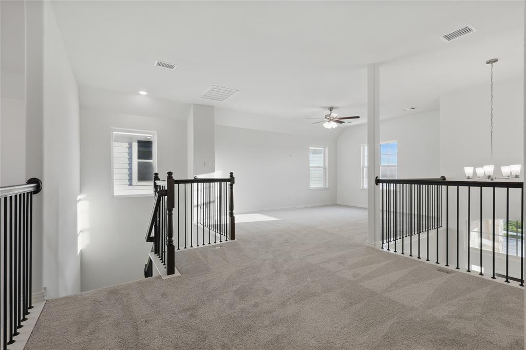 2521 Rivers West Road Anna, TX 75409 - Photo 22 of 40 a view of a hallway with wooden floor and windows