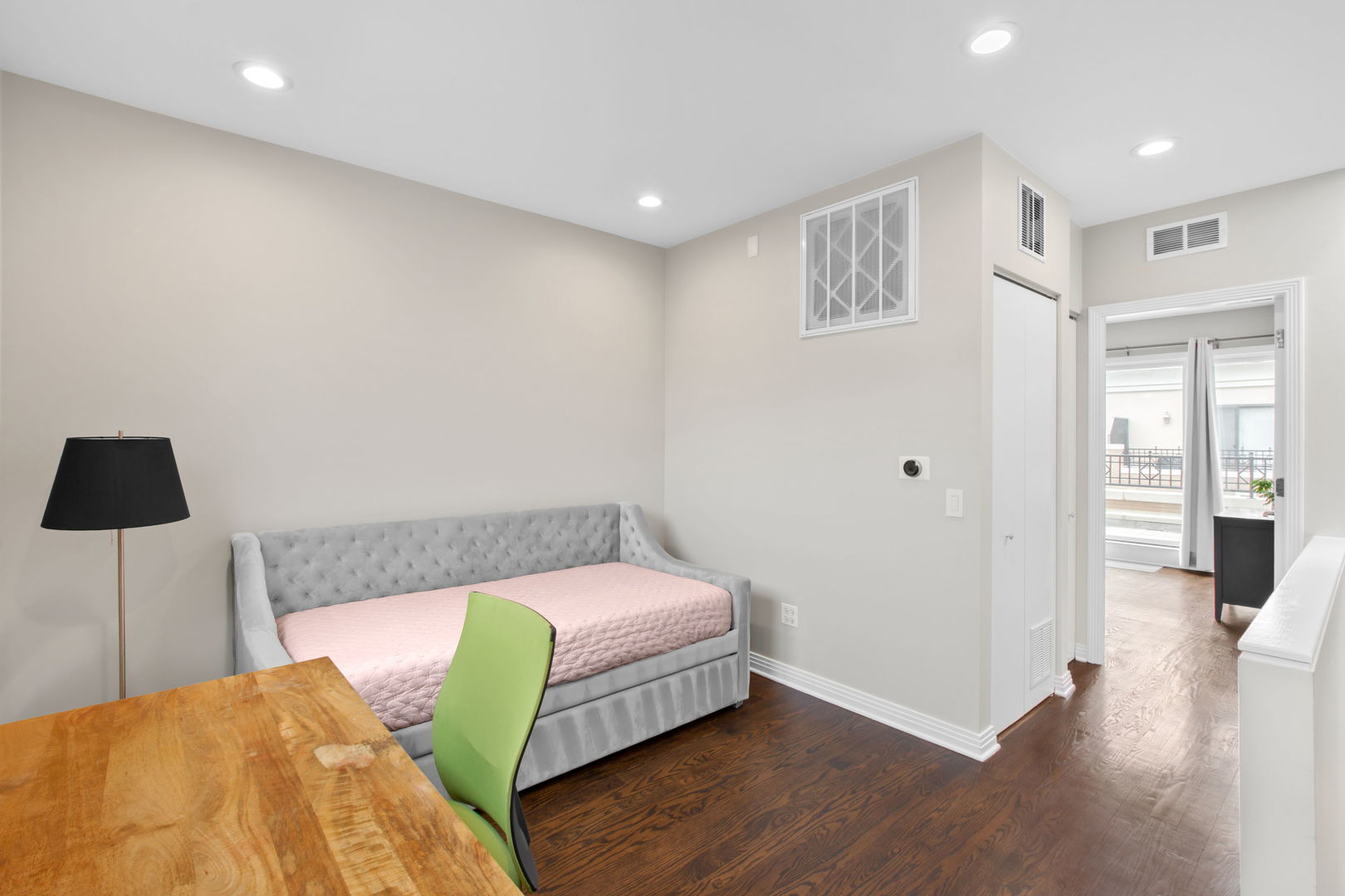1738 South Indiana Avenue Chicago, IL 60616 - Photo 23 of 29 a bedroom with a bed and a flat screen tv