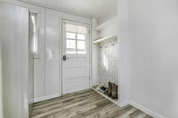 a kitchen with a stove a sink and a refrigerator