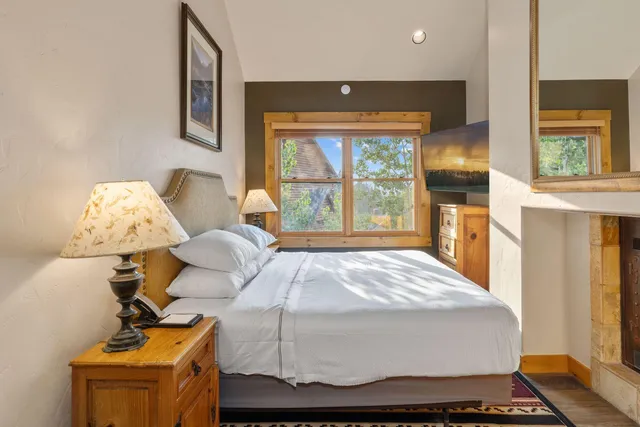 a room with bed and window