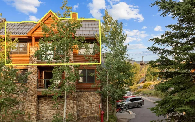 a front view of a house with parking area