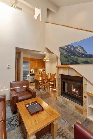 a living room with furniture and a fireplace