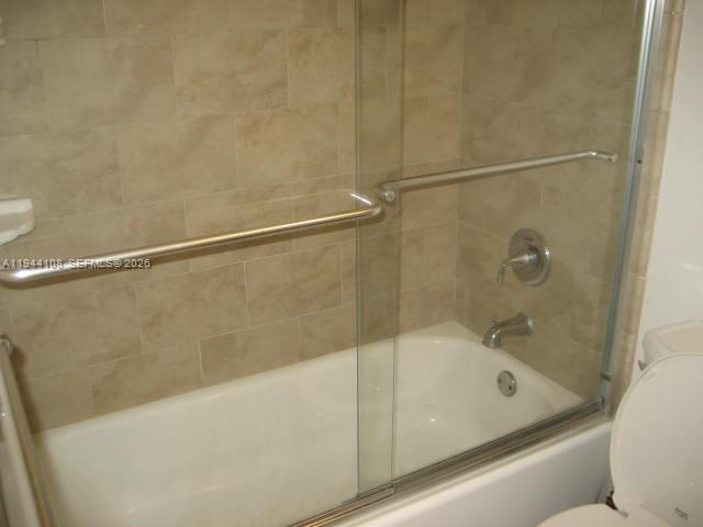 10794 North Kendall Drive, Unit B14 Miami, FL 33176 - Photo 11 of 23 a bathroom with a bathtub and a shower