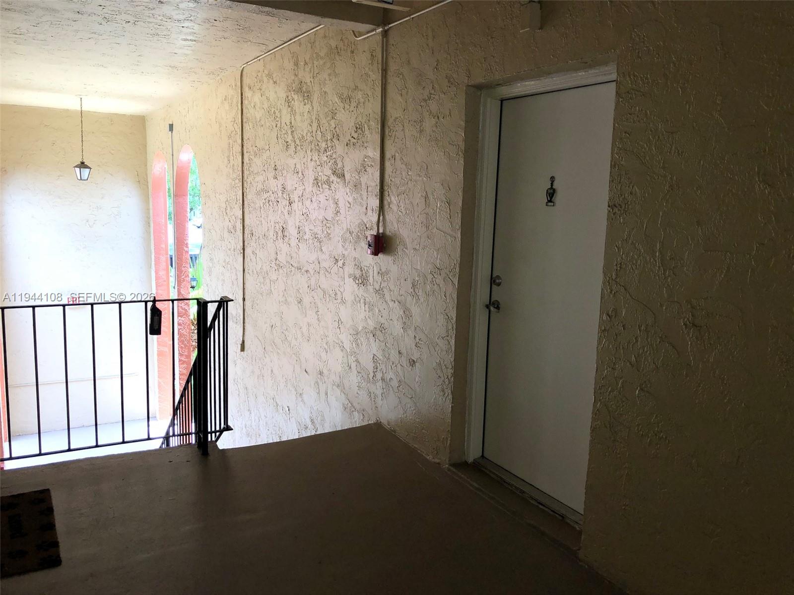 10794 North Kendall Drive, Unit B14 Miami, FL 33176 - Photo 12 of 23 a view of a hallway