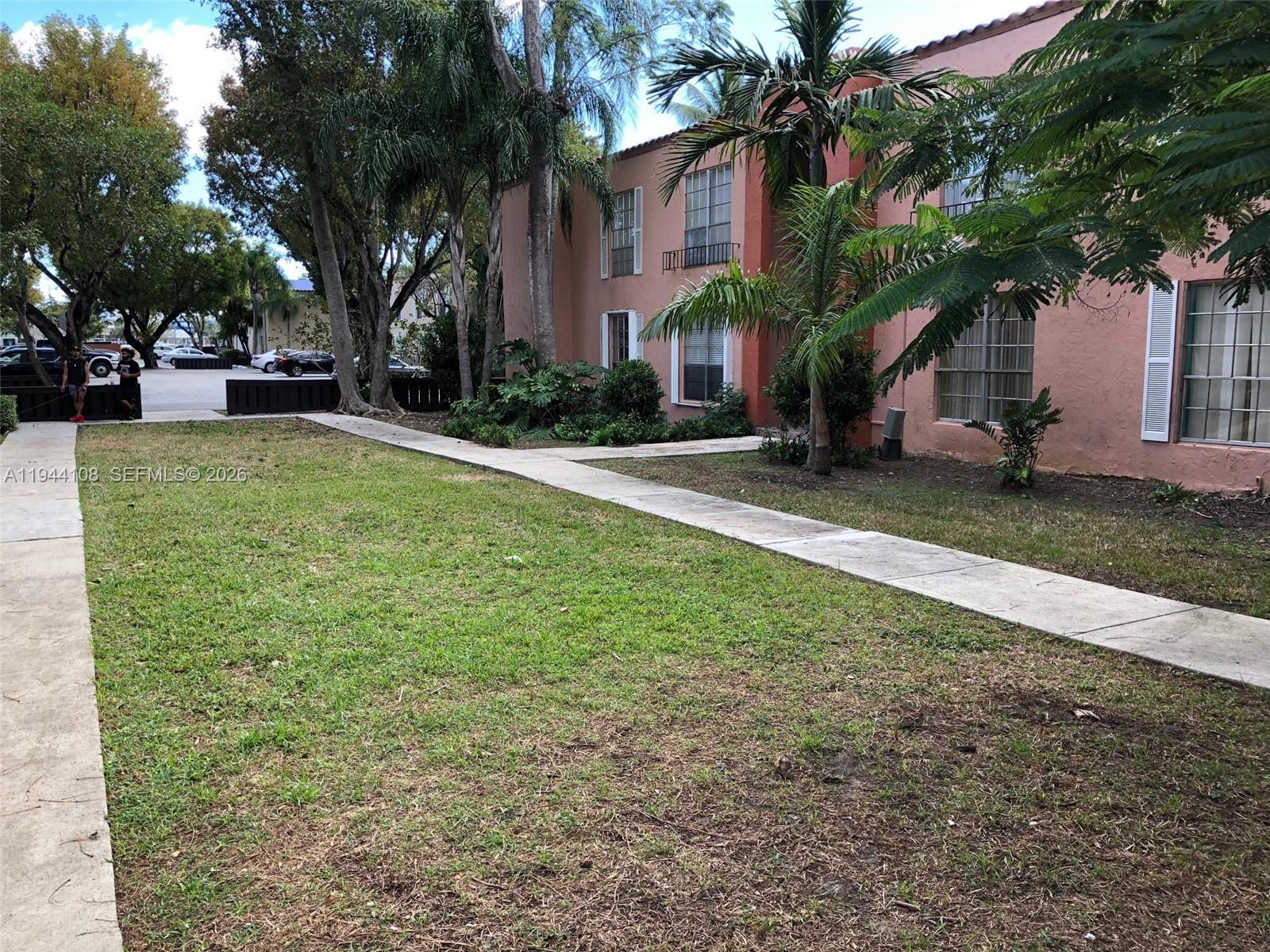 10794 North Kendall Drive, Unit B14 Miami, FL 33176 - Photo 14 of 23 a view of a house with backyard and tree