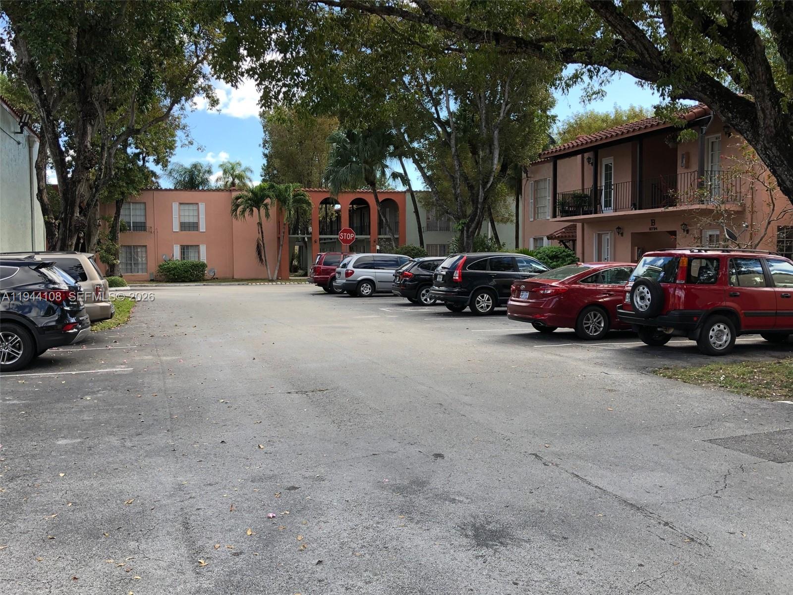10794 North Kendall Drive, Unit B14 Miami, FL 33176 - Photo 16 of 23 a view of a cars parked in front of a house