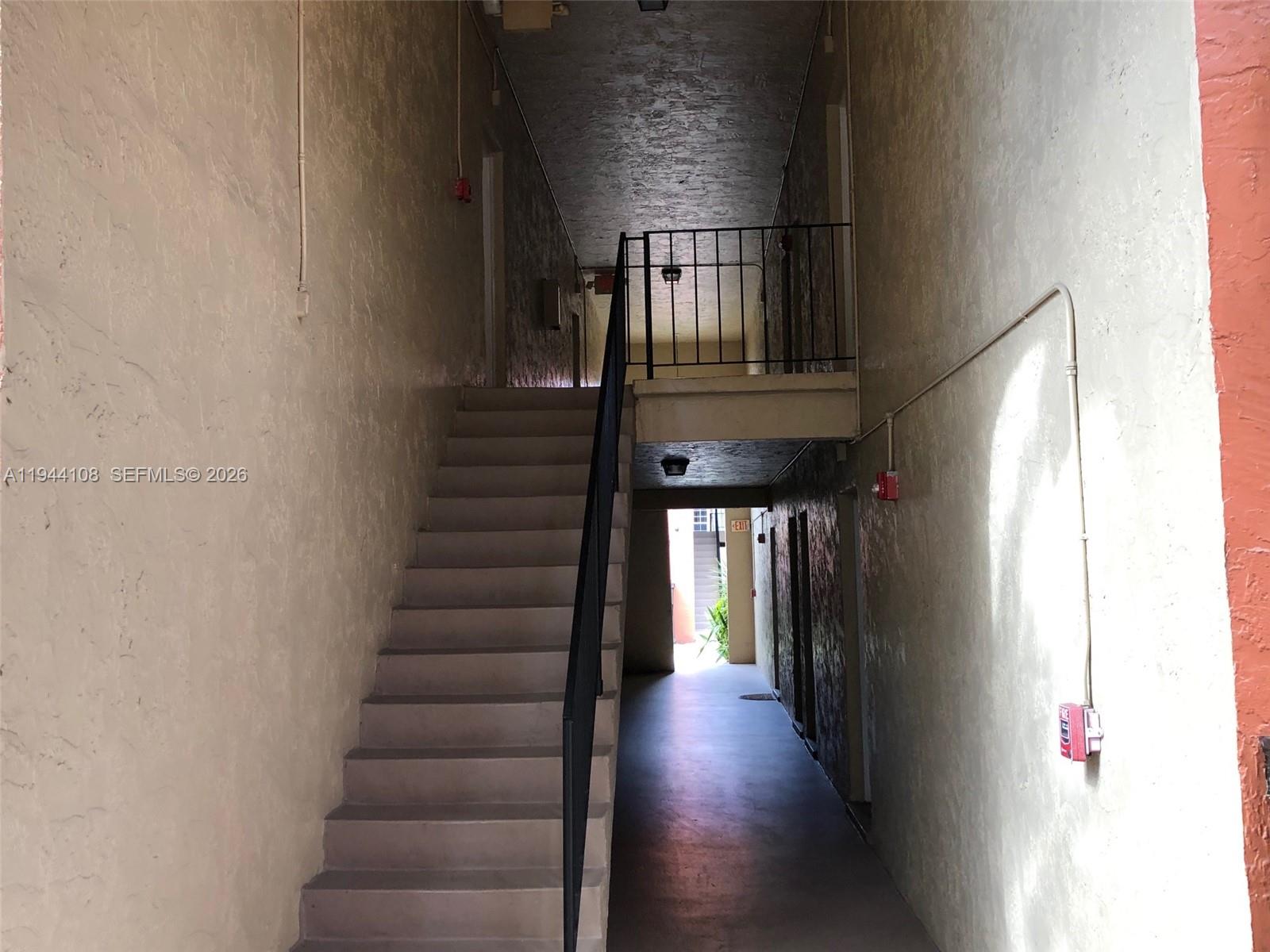 10794 North Kendall Drive, Unit B14 Miami, FL 33176 - Photo 18 of 23 a view of entryway and hall with wooden floor
