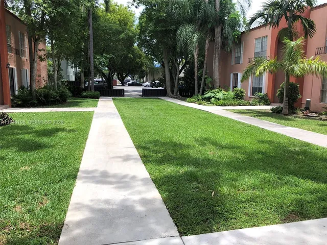 a view of street with parked cars