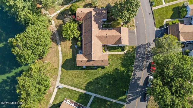 an aerial view of a house with a yard