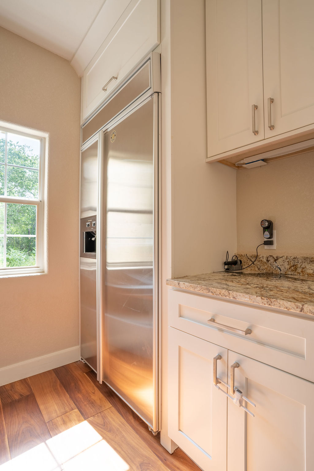 13800 Lone Rider Trail Austin, TX 78738 - Photo 10 of 27 a kitchen with granite countertop a refrigerator and a sink