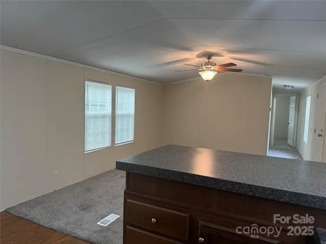 a bathroom with a granite countertop toilet sink and bathtub