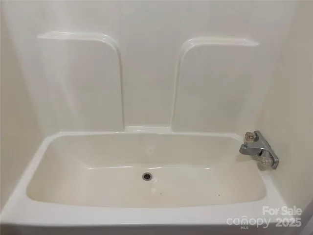 a view of a kitchen with a sink and cabinet area
