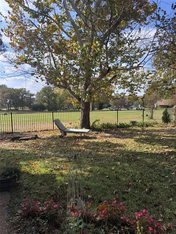a view of backyard with green space