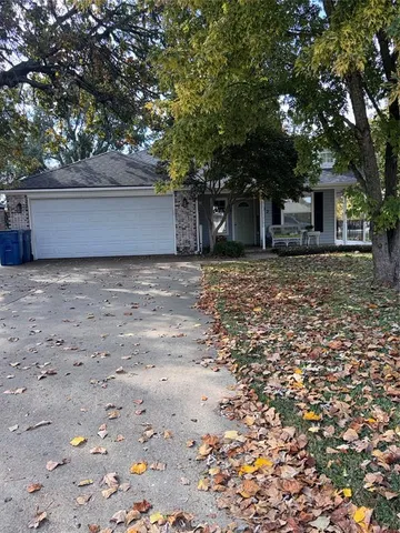 a house with trees in front of it