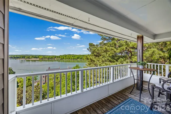a view of a balcony with furniture