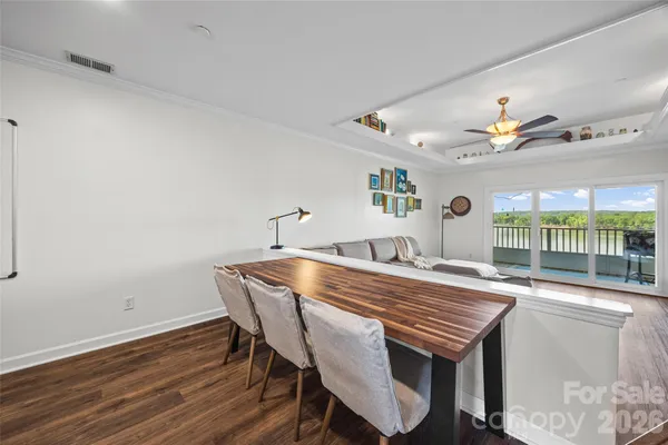 a living room with furniture a ceiling fan and a rug