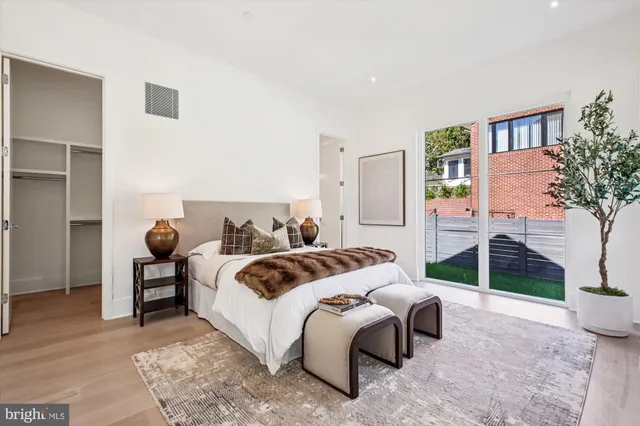 a bedroom with a large bed and a window