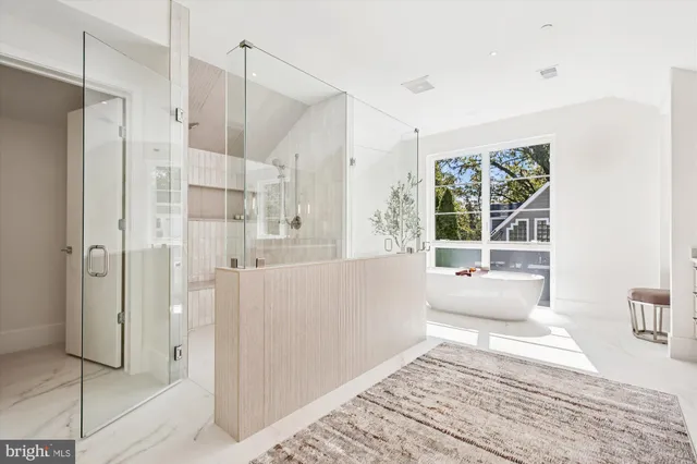 a spacious bathroom with a double vanity sink and a mirror