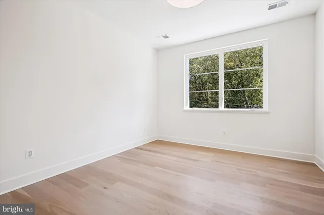 a bathroom with 2 sink and a mirror