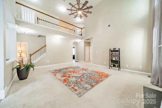 a view of a hallway to a livingroom and a couch