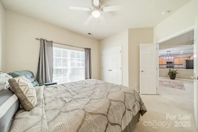 a large white bed in a white room