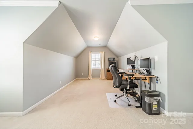 a view of a livingroom with furniture and windows