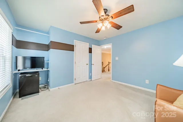 a view of a kitchen with a sink and a refrigerator