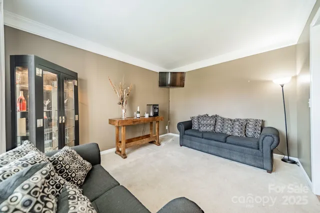 a bedroom with a bed couch and a window