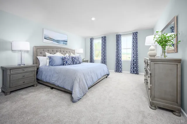 a bedroom with a bed and a couch