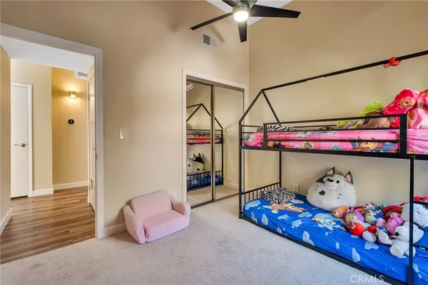 a bedroom with furniture and a chandelier
