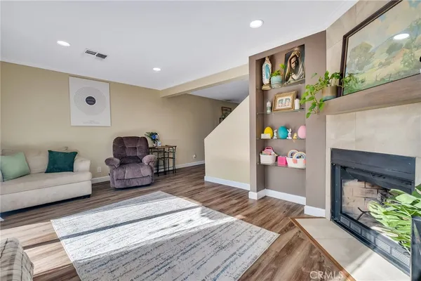 a living room with furniture and a fireplace