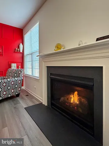 a kitchen with white cabinets and appliances