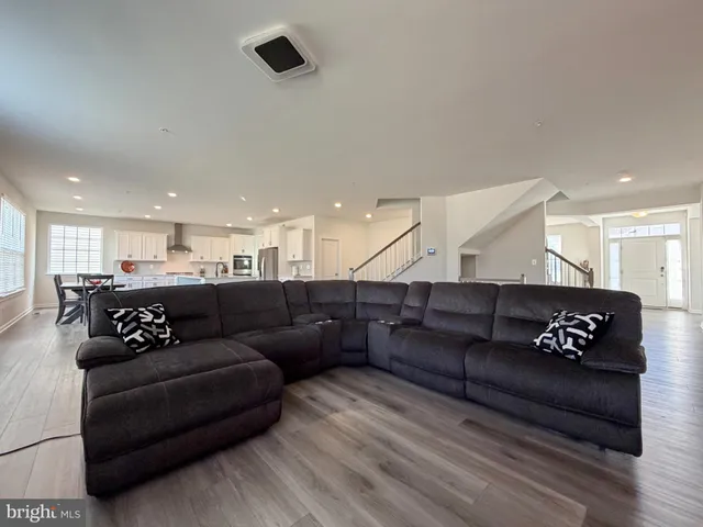 a kitchen with stainless steel appliances a stove a sink and cabinets
