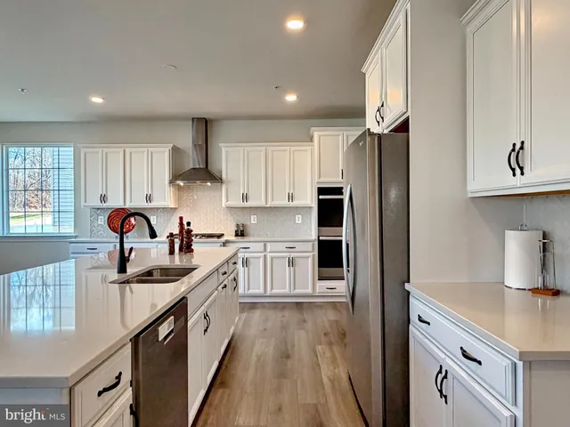 a bedroom with a bed and a television