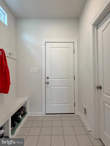 a bathroom with a granite countertop toilet a sink and a bathtub