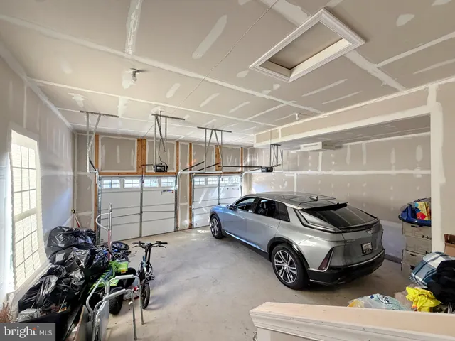 a bathroom with a toilet a sink and a mirror