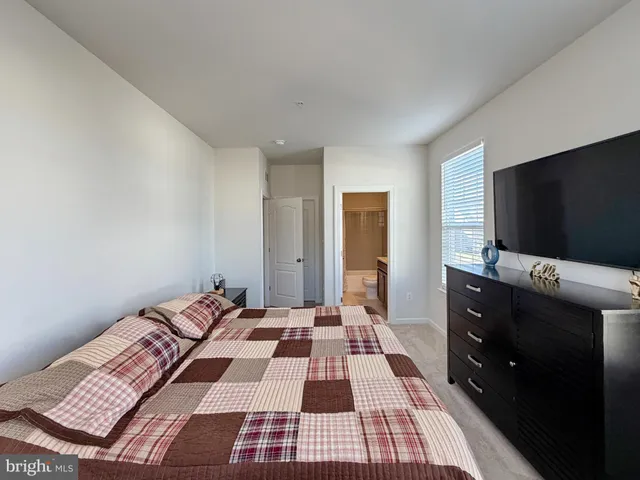 a view of a hallway with livingroom and furniture